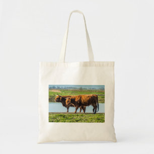 Tote Bag Highland cattle grazing on scenic Wicken Fen UK