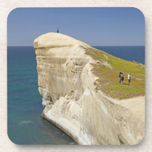 Tourists on cliff top at Tunnel Beach Coaster