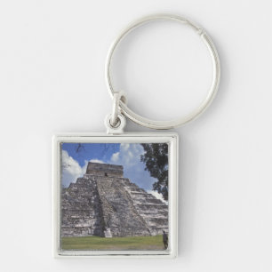 Tourists walk past an unrestored side of El 2 Keychain