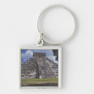 Tourists walk past an unrestored side of El Keychain