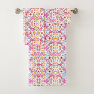 Towels hang on a metal rod featuring a vibrant 