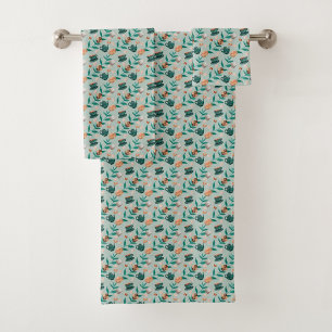 Towels with a teal floral pattern hang 