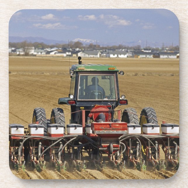 Tractor pulling a seed corn planter. coaster (Front)