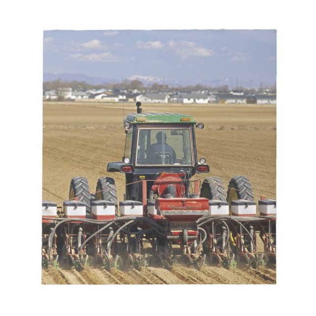 Tractor pulling a seed corn planter. notepad (Front)