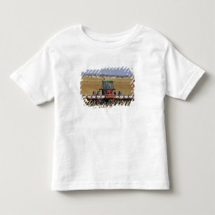 Tractor pulling a seed corn planter. toddler t-shirt