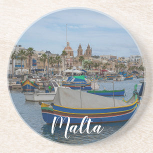 Traditional colorful fishing boats in Malta Coaster