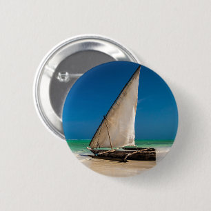 Traditional fishing boat on the beach 2 inch round button