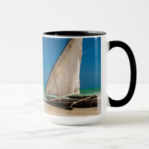 Traditional fishing boat on the beach mug