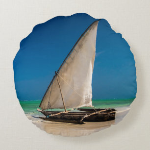 Traditional fishing boat on the beach round pillow