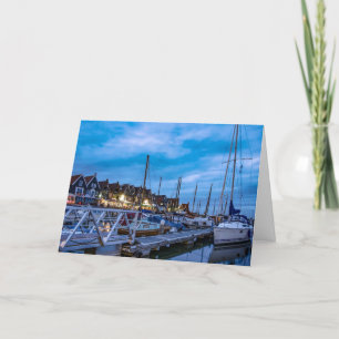 Traditional fishing town night scene holiday card