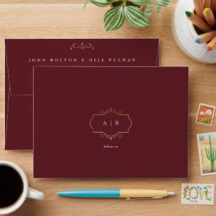 traditional gold crest monogram burgundy wedding envelope