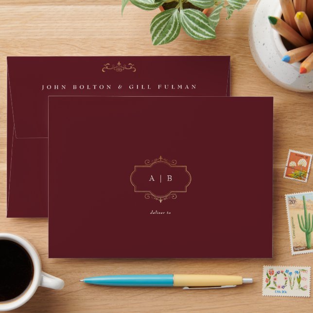 traditional gold crest monogram burgundy wedding envelope (Desk)