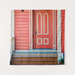 Traditional red painted wooden door and porchdoor, tapestry