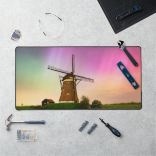Traditional windmill under the Northern Lights Desk Mat