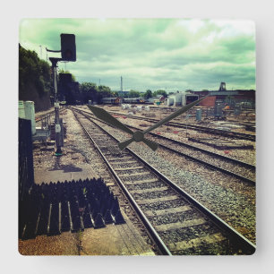 Trains at the depot square wall clock