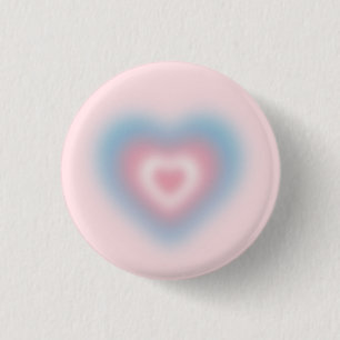 Trans flag colors on a blurred heart 1 inch round button