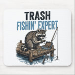 Trash Fishin' Expert Raccoon Mouse Pad<br><div class="desc">Are you a fan of raccoons and fishing? This funny 'Trash Fishin' Expert' design features a master raccoon angler on a wooden dock with his gear. Perfect for anyone who loves trash panda memes, outdoor fishing trips, and a good laugh. This vintage-style illustration is a great gift for fishers, outdoorsmen,...</div>