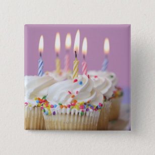 Tray of birthday cupcakes with candles 2 inch square button
