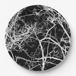 Tree branches on black background paper plate