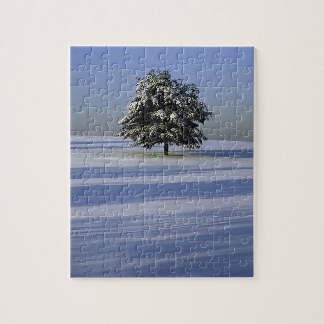 Tree in snow covered landscape jigsaw puzzle (Vertical)