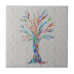 Tree of Life Grey Ceramic Tile<br><div class="desc">This decorative tile features a unique Tree of Life design on a background in shades of grey. It was originally made in mosaic using tiny pieces of brightly coloured glass. Please note that the background is in different shades and will not match up seamlessly however is perfect for an accent...</div>