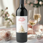 Tree snow white red script Christmas Wine Label<br><div class="desc">A white background and red text.  Decorated with a snowcovered pine tree. Merry Christmas is written with an elegant hand-lettered style script.  Personalize and add your family name and year.</div>