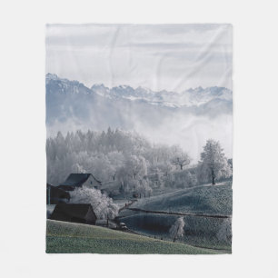 TREES BESIDE SNOW CAPPED MOUNTAIN DURING DAYTIME FLEECE BLANKET