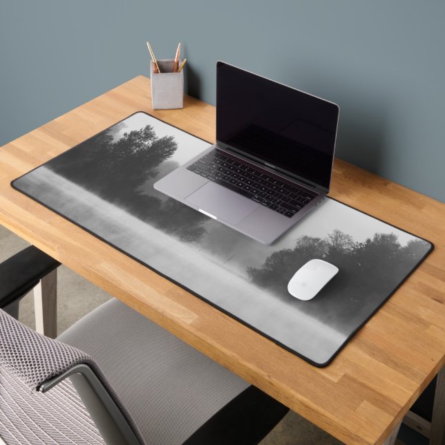 Trees disappearing in morning fog above the lake desk mat (Office 2)