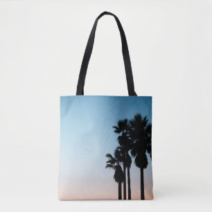 Trees during golden hour tote bag