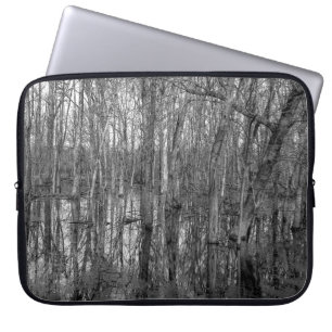 Trees in a forest in black and white. beauty in na laptop sleeve