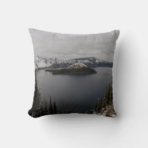 TREES ON SNOW COVERED MOUNTAIN NEAR BODY OF WATER THROW PILLOW