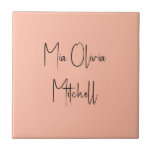 Trend Colour Soft Peach Name Ceramic Tile<br><div class="desc">Introducing the trendy spring shade: Soft Pastel Peach. Elevate your home decor with our modern and stylish ceramic tile, featuring a customizable name in a charming handwritten font in classic black, looking like a signature. Its elegant and minimalist design in solid colours exudes timeless appeal, making it perfect for personal...</div>