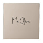 Trend Colour - Soft Taupe Name Ceramic Tile<br><div class="desc">Introducing the classic and elegant spring shade: Soft Taupe. Elevate your home decor with our modern and stylish ceramic tile, featuring a customizable name in a charming handwritten font, looking like a signature. Its elegant and minimalist design in solid colour exudes timeless appeal, making it perfect for personal use or...</div>