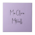 Trend Colour Soft Violet Name Ceramic Tile<br><div class="desc">Introducing the vibrant spring shade: Soft Violet. Elevate your home decor with our modern and stylish ceramic tile, featuring a customizable name in a charming handwritten font in classic black, looking like a signature. Its elegant and minimalist design in solid colours exudes timeless appeal, making it perfect for personal use...</div>