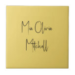 Trend Colour Soft Yellow Name Ceramic Tile<br><div class="desc">Introducing the vibrant spring shade: Soft Yellow. Elevate your home decor with our modern and stylish ceramic tile, featuring a customizable name in a charming handwritten font in classic black, looking like a signature. Its elegant and minimalist design in solid colours exudes timeless appeal, making it perfect for personal use...</div>