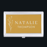 Trendy Boho Chic Minimalist Mustard Yellow Custom Business Card Holder<br><div class="desc">Our Trendy Boho Chic Minimalist Mustard Yellow Custom Business Card Case, the perfect accessory for the modern professional. Designed with elegance and sophistication in mind, this business card case features a chic mustard yellow exterior adorned with a delicate flower drawing. The minimalist design, complemented by trendy typography, ensures a sleek...</div>