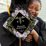 Trendy Gold Purple Floral Medical Nursing Graduation Cap Topper<br><div class="desc">Celebrate your nursing graduation in style with our custom cap topper! Crafted with a trendy black background that sets off the playful purple watercolor flowers perfectly. The symbol of caduceus exhibits your medical prowess while your name and class year make it exclusively yours. A fashion-forward way to mark your achievement!...</div>