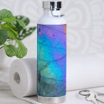 Trendy Modern Marble Stone Colourful Water Bottle<br><div class="desc">Stunning and colourful rainbow hued labradorite stone photo makes the perfect backdrop for a simple and modern design. This is a closeup of a real natural labradorite stone with blue, purple, pink, yellow, and green. Chic Modern Stylish Crystal Stone Colourful Water Bottle</div>