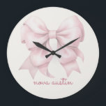 Trendy Pink Bow Personalized With Name Monogram Large Clock<br><div class="desc">Add a touch of timeless elegance to your decor with the Trendy Pink Bow Personalized With Name Monogram Large Clock. Featuring a chic preppy coquette bow in a soft pink watercolor design, this clock combines vintage girly charm with modern sophistication. The personalized name monogram makes it a unique and thoughtful...</div>