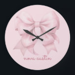 Trendy Pink Bow Personalized With Name Monogram Large Clock<br><div class="desc">Transform any room with the Trendy Pink Bow Personalized With Name Monogram Large Clock, a perfect blend of style and personalization. This elegant clock features a preppy coquette bow in a soft pink watercolor design, making it a charming addition to any space. The personalized name monogram adds a unique touch,...</div>