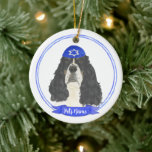 Tricolor English Springer Spaniel Hanukkah Ceramic Ornament<br><div class="desc">Celebrate your favourite mensch on a bench with a personalized ornament! This design features a sweet illustration of a tricolor english springer spaniel dog with a blue and white yarmulke. For the most thoughtful gifts, pair it with another item from my collection! To see more work and learn about this...</div>