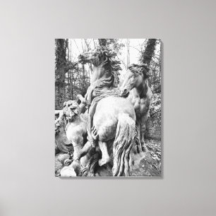 Tritons grooming two horses of the sun canvas print