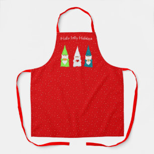 Trois lutins de Noël sur un tablier rouge