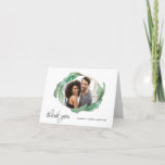 Tropical Banana Leaves Thank You with Photo<br><div class="desc">Thank your wedding guests with a unique photo card featuring an oval cutout frame surrounded by lush tropical banana leaves. Modern thank you text is written on the lower left of the card and a text template for the bride and groom's names is on the lower right side of the...</div>