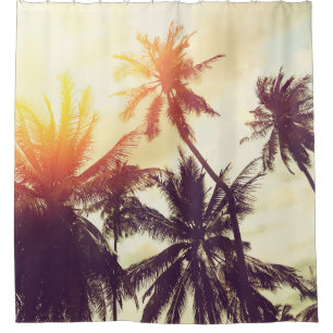 Tropical beach background with palm trees silhouet