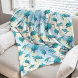 Tropical Beach Christmas Sea Turtle Fleece Blanket<br><div class="desc">When the weather outside is frightful, and you are dreaming of a nice warm sunny tropical beach, wrap yourself in this coastal themed Christmas sea turtle fleece blanket, featuring a pattern of cute turquoise blue sea turtles on an abstract beach background with a faux glitter wave and sparkly star accents....</div>