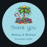 Tropical Christmas Palm Tree Thank You Classic Round Sticker<br><div class="desc">Thank you stickers with a seasonal holiday image. A tropical palm tree decorated in festive lights with a star on top. A giant red and white candy cane sticking out of the sand. Christmas presents under the tree. Whimsical and fun.</div>
