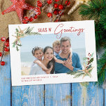 Tropical Christmas Starfish Seas N Greetings Photo Holiday Card<br><div class="desc">This coastal themed tropical beach Christmas card features a photo template framed in 2 corners with starfish decorated with holly leaves,  berries,  and pine sprigs,  with the beachy holiday greeting “seas n’ greetings” in modern handwriting script.</div>