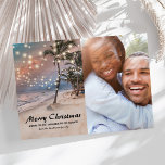 Tropical Coastal Beach Christmas Photo Holiday Card<br><div class="desc">Indulge in a unique holiday spirit with our Vintage Beach Christmas cards! Set against a backdrop of a sunset-drenched tropical beach and lush palm trees, our cards artfully blend the magic of Christmas with the charm of balmy beach vibes. The twinkling string lights and your family photo add a personalized...</div>