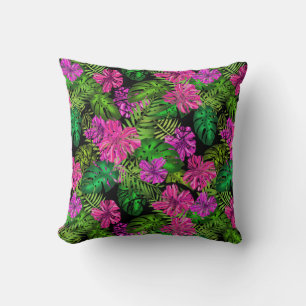 Tropical flowers and plants on black throw pillow